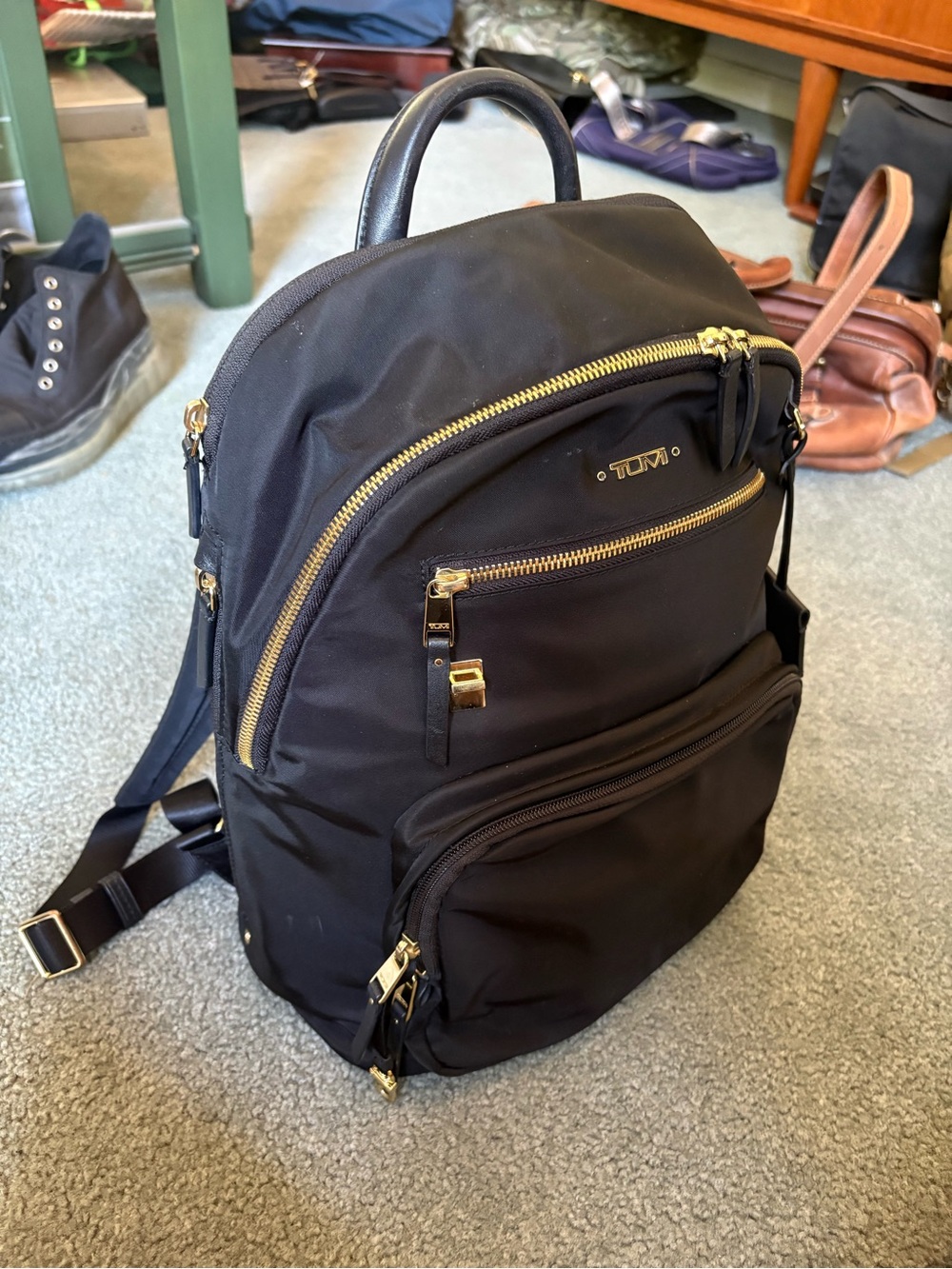 TUMI Luxury Black Nylon Backpack with Gold Hardware and Leather Trim